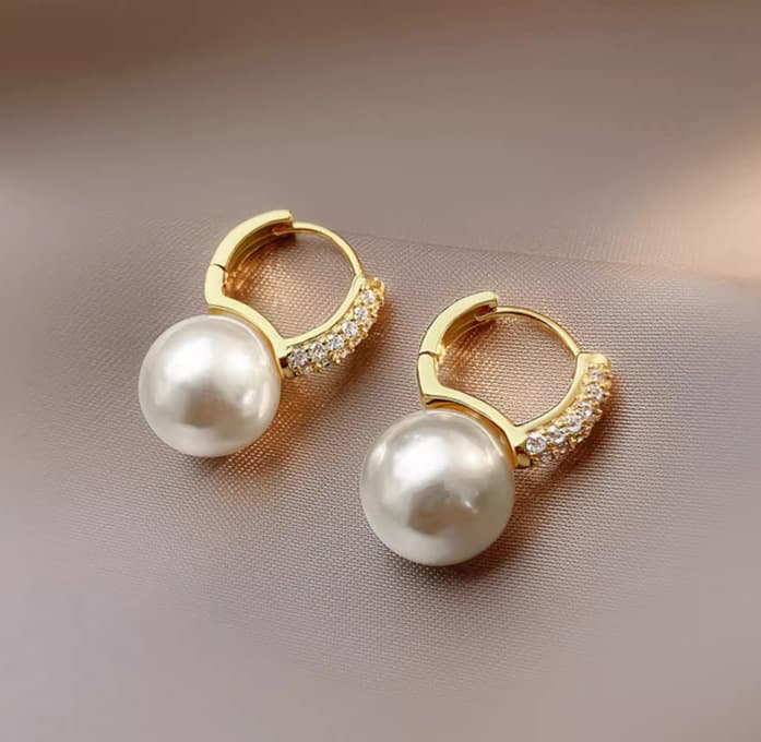Elegant Pearl Huggie Hoop Earrings worn